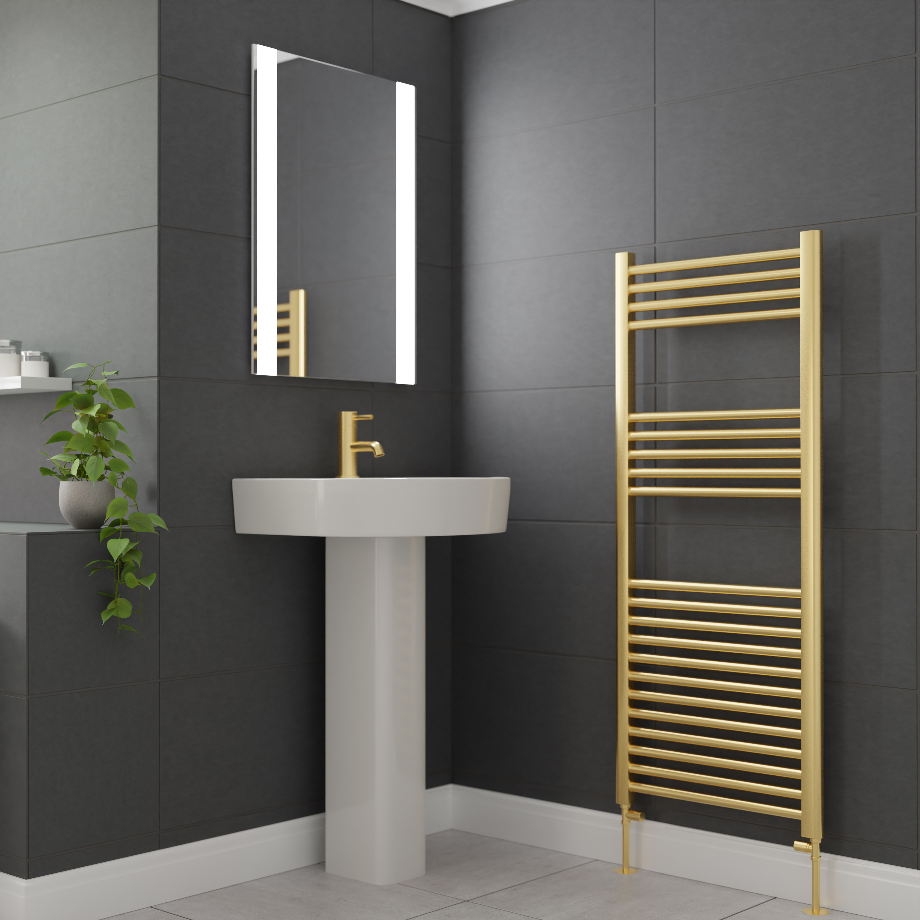Brushed brass heated towel rail with matching tapware